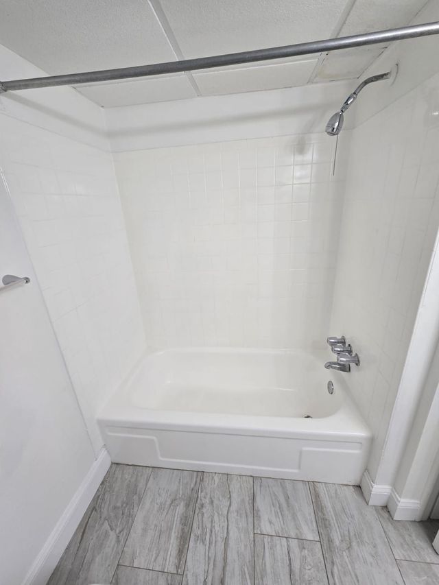Bathroom with soaking tub at Chateau Apartments