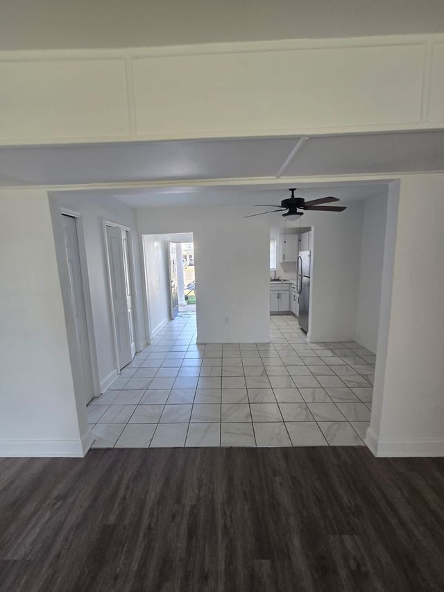 Living room looking toward the kitchen at Chateau Apartments