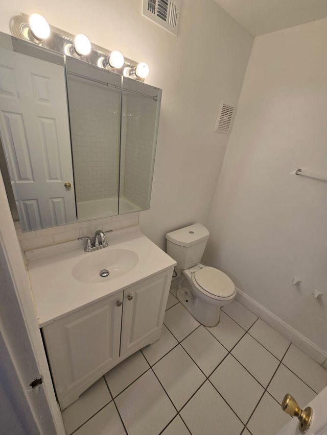 White bathroom vanity at Chateau Apartments